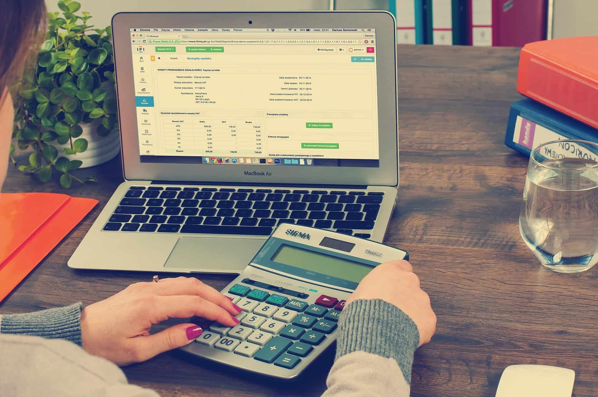 Bookkeeping records and a calculator on a desk