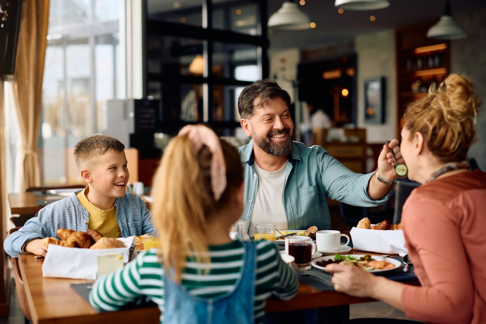 A family having breakfast together in a restaurant